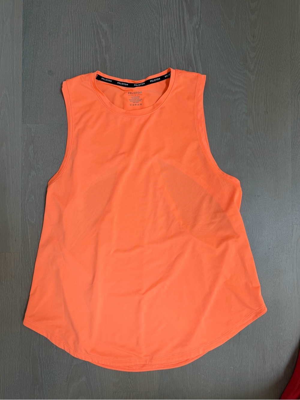 Peloton women’s open back Orange Performance Muscle Tank